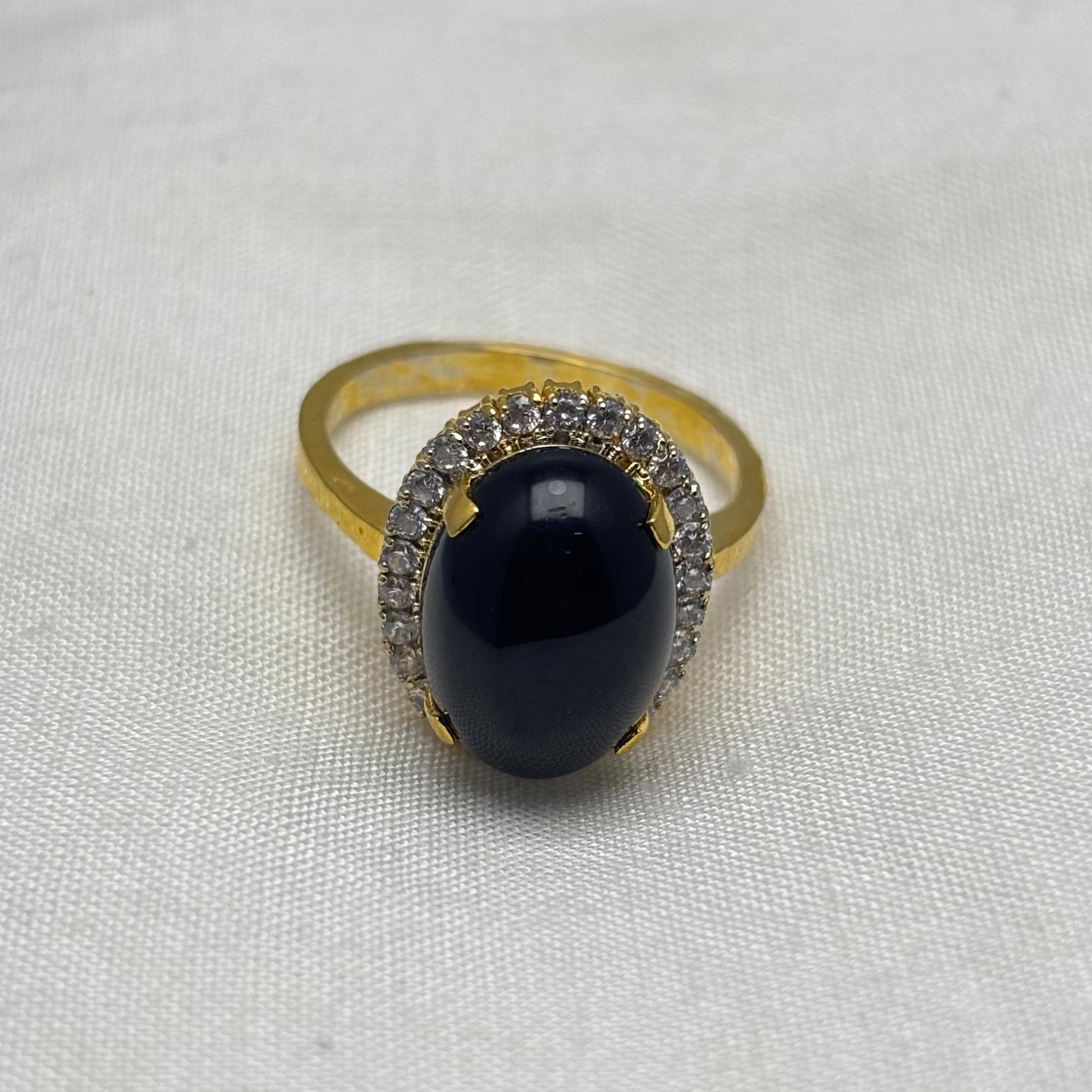 Gold plated black oval stone ring